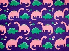 BTY*FACE MASKS*PINK & GREEN DINOSAURS ON PURPLE FLANNEL 100% COTTON FABRIC 1YD