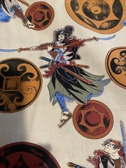 Asian fighters and symbols on light tan 1 yd x 44″
