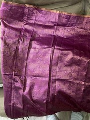 4 yards of fabric purple and gold, patterned, clips on top in the middle