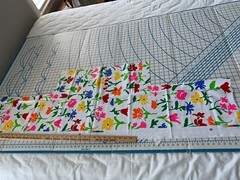 NEW: 1-1/2 yards x 18″ wide (less cut-outs) of a “BRIGHT FLORAL” heavy cotton