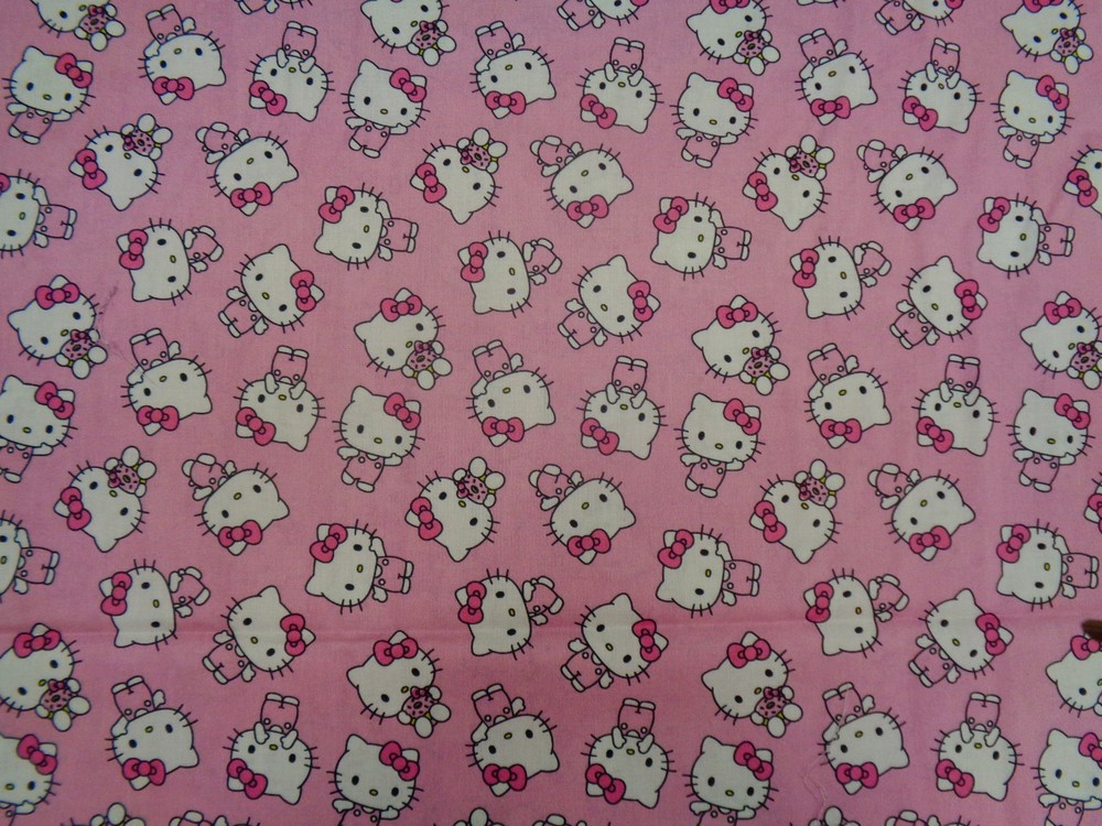 HELLO KITTY TOSSED DESIGN ON PINK BACKGROUND 100% COTTON 1/2 YARD PIECE
