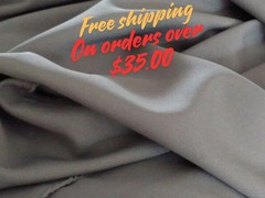 Grey Tropical 100% Polyester non-stretch, machine washable.