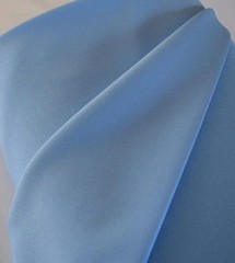 Light Blue Tropical 100% Polyester non-stretch, machine washable.