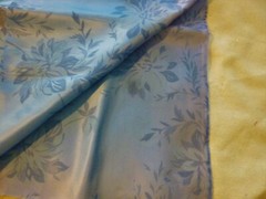 Light blue polyester / acetate fabric with large blue floral pattern -44″ by 54″