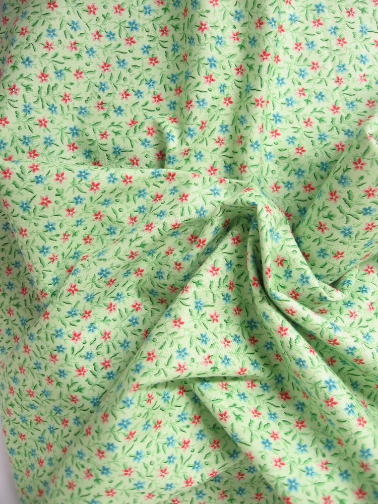 Apple Green Fabric with tiny Red & Blue Flowers Quilting Treasures – BTY – 44″