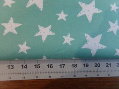 cotton flannel fabric white stars on aqua background 42″ wide by the 1/2 yard