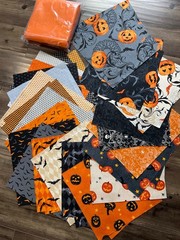 Midnight Haunt Layer Cake, + 2.5 yds orange (clementine) Kona Cotton fabric