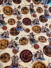Asian fighters and symbols on light tan 1 yd x 44″