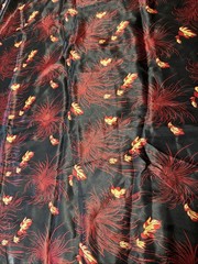 Red and gold on black background Satin Type Fabric 60” w x 36” l leaves