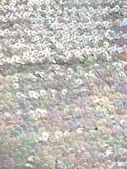 EUC iridescent white sequined fabric on white cotton knit backing, 1.5ydLx34″W